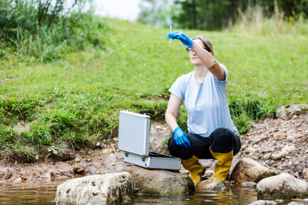 istock Mature woman collected river water sample for analysis 1625983598