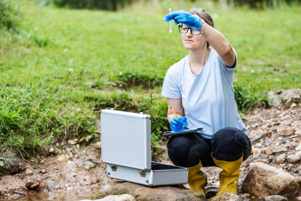 istock Mature woman collected river water sample for analysis 1625987252