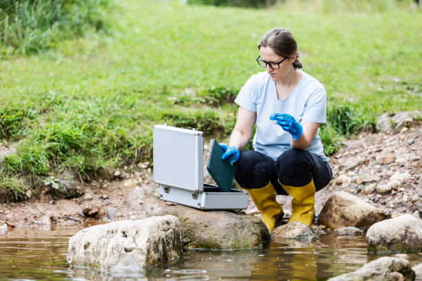 istock Mature woman collected river water sample for analysis 1625995274