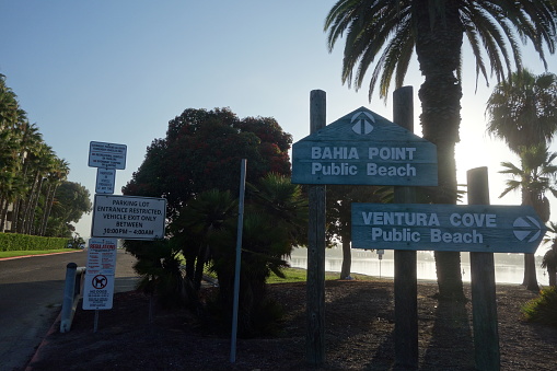 Early morning at Mission Bay Bahia Point and Ventura Cove public beach entrance, San Diego city ordinance and rules posted nearby