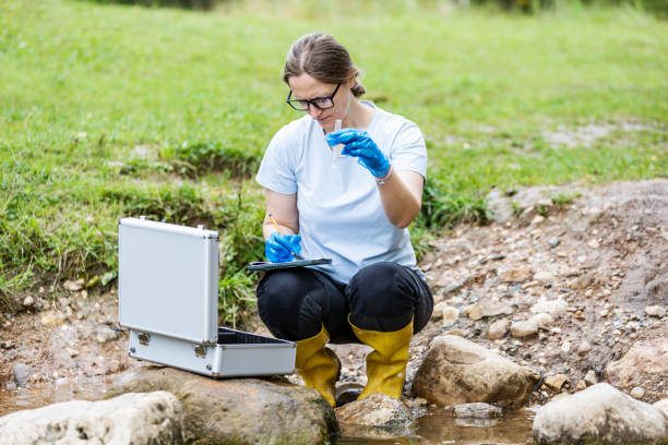 istock Mature woman collected river water sample for analysis 1626009435