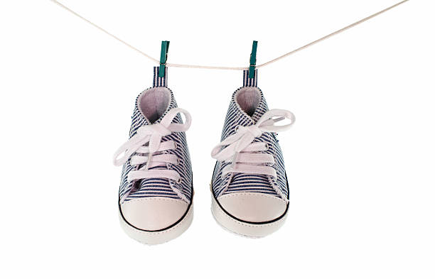 istock baby shoes hanging 162603596