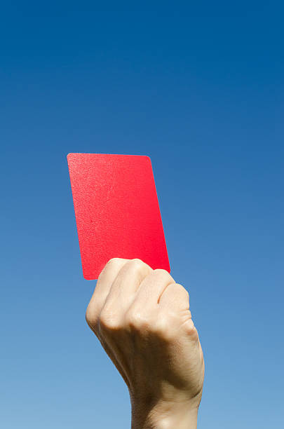 istock Red card in the hand again blue sky 162604098
