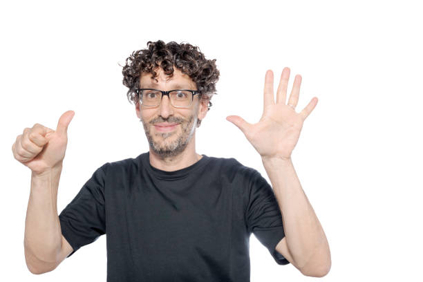 istock Middle-aged man making the number six with his fingers, on white background. 1626067239