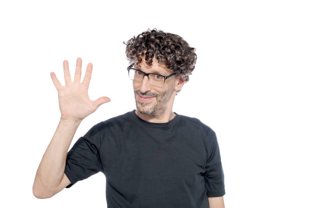 istock Middle-aged man making the number five with his fingers, on white background. 1626067240