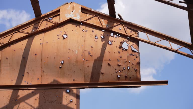 Bullet holes in the iron door. War in Ukraine