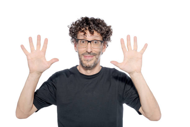 istock Middle-aged man making the number ten with his fingers, on white background. 1626069877