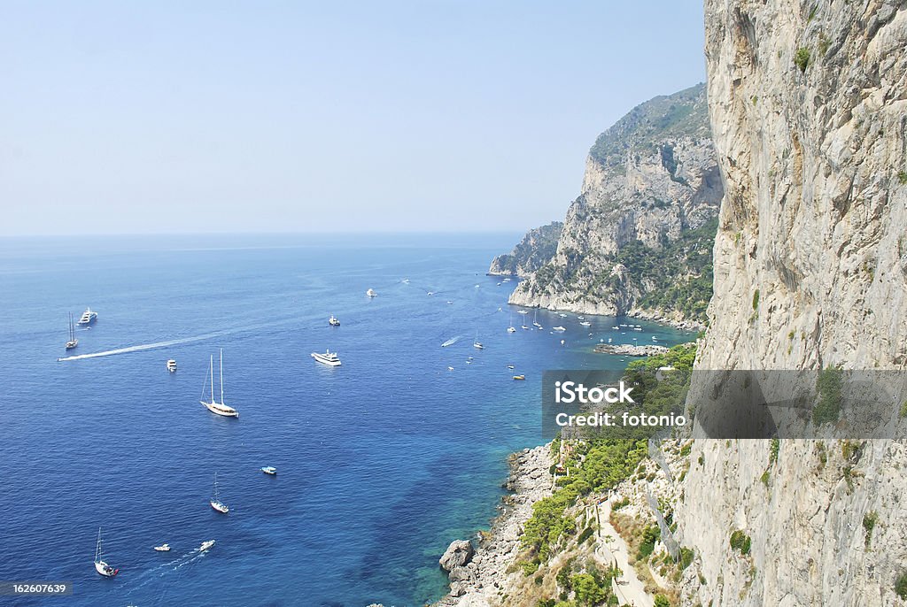 Capri coastline Rock sea and ships in Capri Amalfi Coast Stock Photo