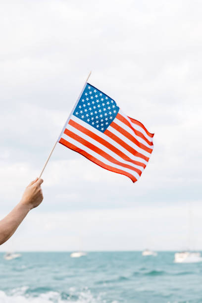 istock An American flag waving in the blue sky 1626145976