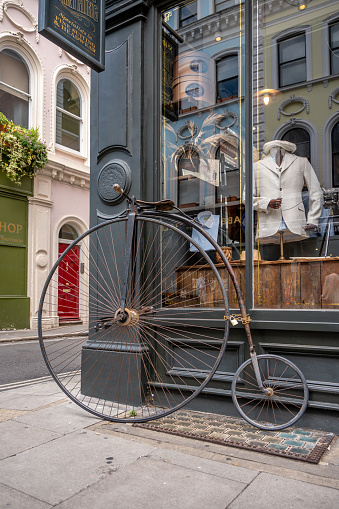 London, UK - July 18, 2023: Antique bicycle outside Thomas Farthing building on Museum Street