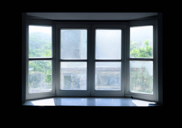 istock A dirty window looking outside from a dark room 1626171817