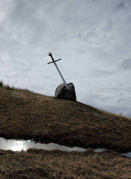 A medieval sword stuck in a rock