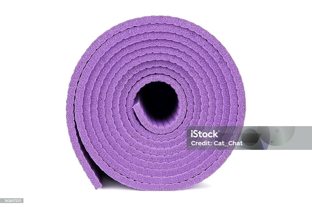 Yoga equipment Rolled up yoga mat isolated on white Exercise Mat Stock Photo