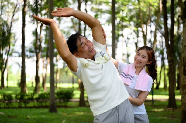 istock Daughter Joins Senior Parent for Heartwarming Exercise. 1626185561