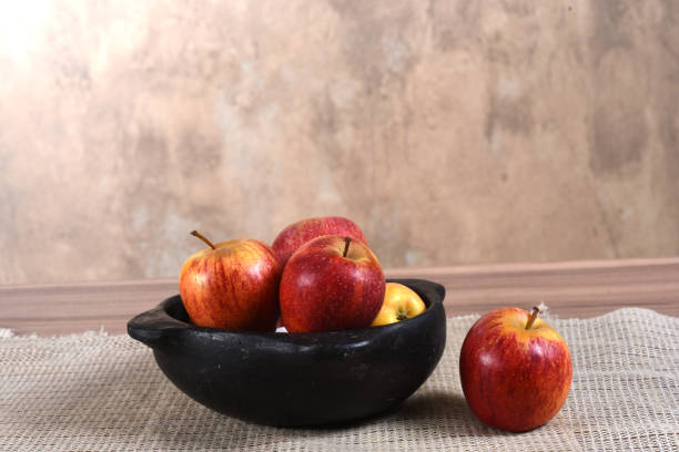 istock natural and healthy tropical fruit apples on the table on white texture background 1626223021