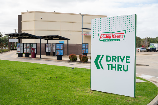 Paralowie, Australia - May 05, 2023: Krispy Kreme store signage at the service station off Port Wakefield Road in Paralowie, South Australia