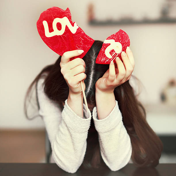 Lonely sad girl with broken heart stock photo