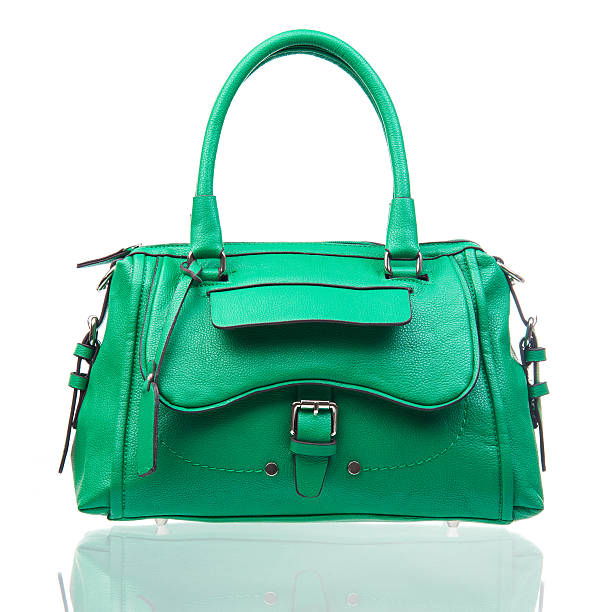 istock Green female handbag over white 162623655
