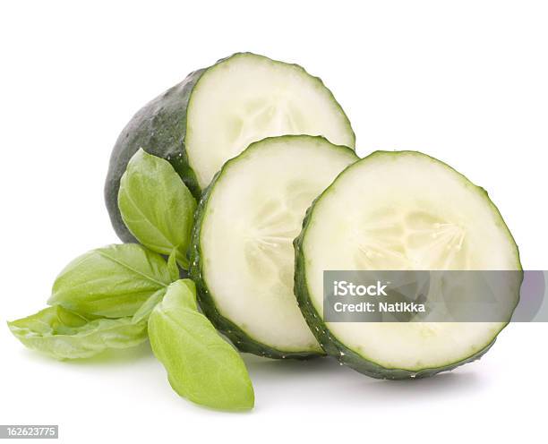 Sliced Cucumber Vegetable And Basil Leaves Still Life Stock Photo - Download Image Now