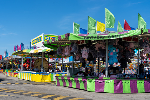 Toronto, ON, Canada - September 2, 2022: Midway Game at CNE (Canadian National Exhibition) in Toronto.  CNE is an annual event that takes place at Exhibition Place in Toronto.