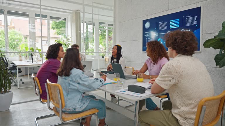 Creative Diverse Team of Gen Z at a Work Meeting