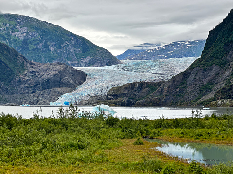 The Mendenhall Glacier has retreated 1.75 miles since 1929 due to climate change. It is receding so quickly that by 2050, it might no longer be visible from the visitor center it once loomed outside.