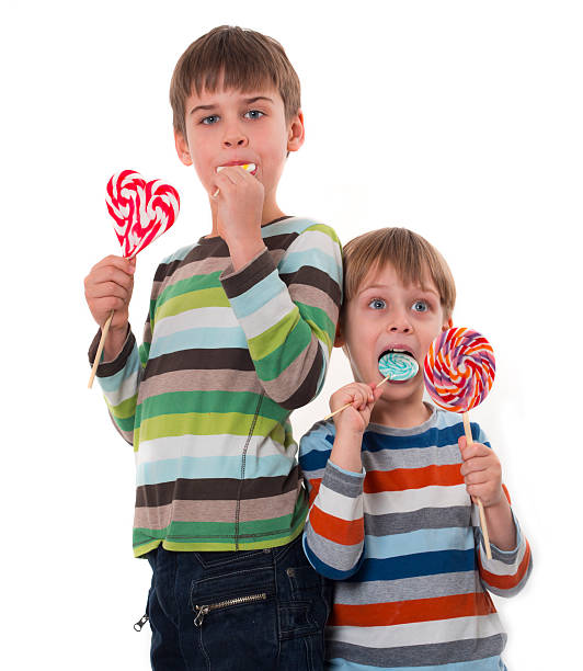 istock happy children with lollipops 162629530
