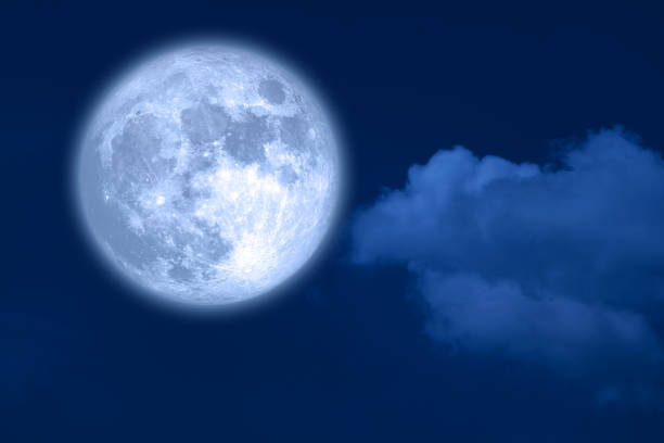 istock Super blue moon and white silhouette cloud sky in the night sky 1626334366
