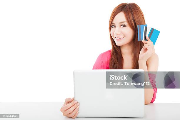 Beautiful Young Woman Holding Credit Card With Laptop Stock Photo - Download Image Now