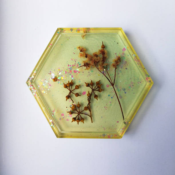 istock Handmade resin coaster with floral pattern on white background. Selective focus. 1626364778