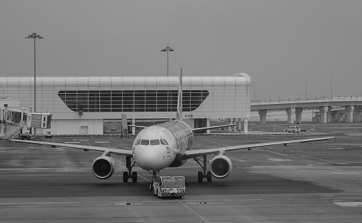 Kuala Lumpur, Malaysia - Dec 16, 2015. An AirAsia aircraft on runway at the KLIA Airport in Kuala Lumpur, Malaysia. KLIA is the world 23rd-busiest airport by total passenger traffic.