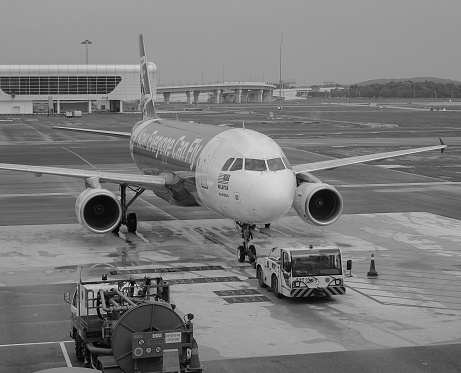 Kuala Lumpur, Malaysia - Dec 16, 2015. An AirAsia aircraft on runway at the KLIA Airport in Kuala Lumpur, Malaysia. In 2015, KLIA handled 48,938,424 passengers and 726,230 tonnes of cargo.