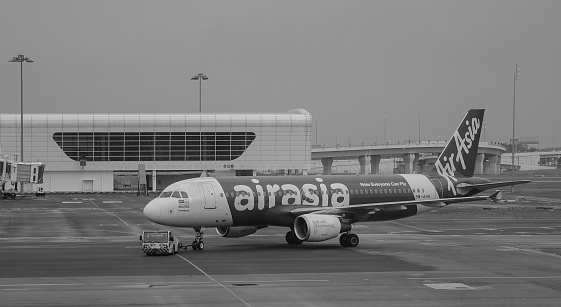 Kuala Lumpur, Malaysia - Dec 16, 2015. An AirAsia aircraft at the KLIA Airport in Kuala Lumpur, Malaysia. KLIA is the world 23rd-busiest airport by total passenger traffic.