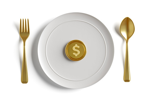 Golden US dollar coins placed in white plate golden cutlery on white background. Concept is business profits, market share, dividends, investment, Charity, Money Fraud. Clipping path. 3D Illustration.