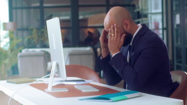 Sad Tired Worker Overworked On Computer.Unhappy Frustrated Businessman.