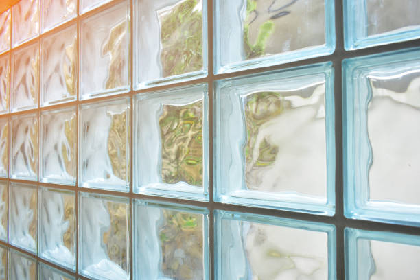istock close up glass block wall with golden natural light background, interior design 1626496286