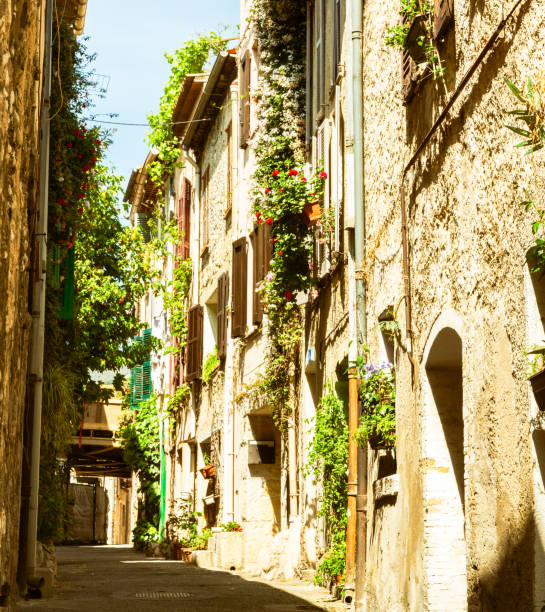 istock Old style image three story builkding lining narrow typically Mediterranean residential lane 1626497356