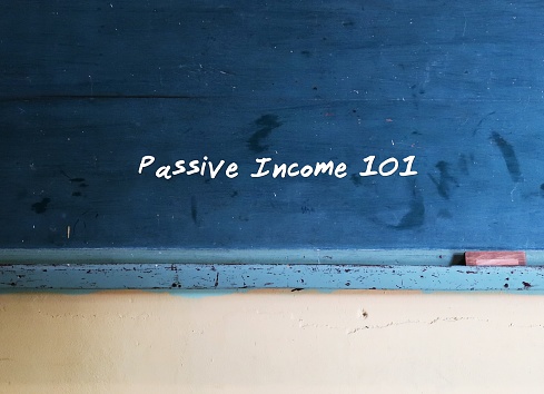 Chalkboard with text written PASSIVE INCOME 101 , concept of earning sustained income from passive source  generates long-term steady gains income, invest collect payment over time