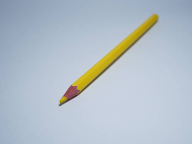istock a yellow colored pencil on a white background 1626562471