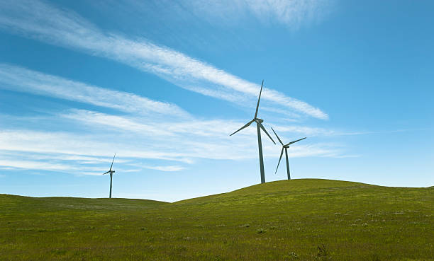 istock Wind turbines on green hill 162658388
