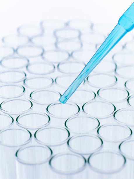 istock Droplet Falling from Pipette into Test Tube. 1626600152