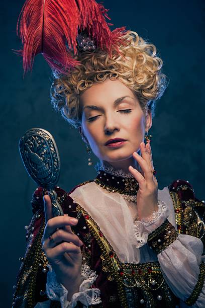 istock Haughty queen in royal dress with mirror 162660482