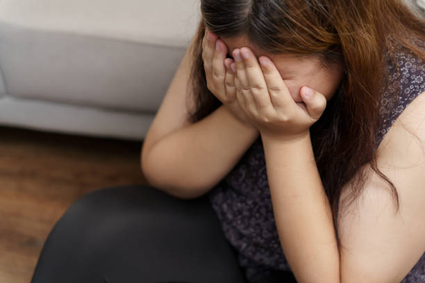 istock Sad Overweight plus size woman thinking about problems on sofa upset girl feeling lonely and sad from bad relationship or Depressed woman disorder mental health 1626611354