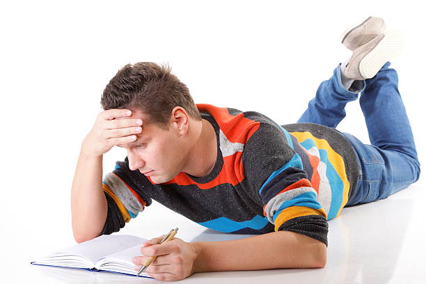 istock tired college student after hard work for exam 162667284