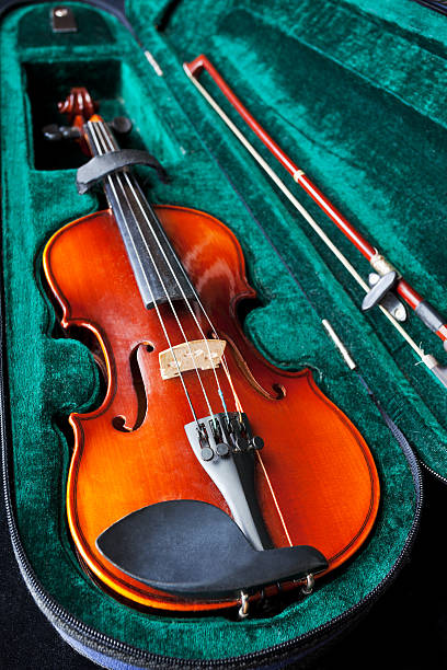 istock fiddle with bow in green velvet box 162667475