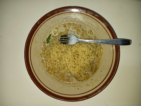 Boiled instant noodles on a plate.