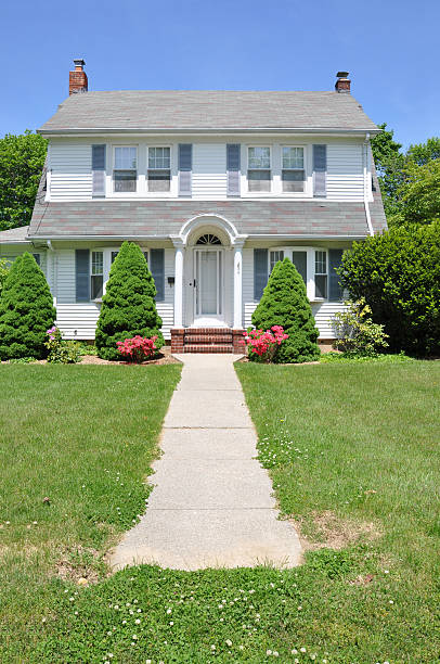 istock Suburban Colonial Home Walkway Sunny Blue Sky Day 162669590