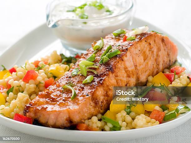 Grilled Salmon With Couscous Stock Photo - Download Image Now - Couscous, Roasted Salmon, Salmon - Seafood