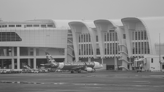 Kuala Lumpur, Malaysia - Dec 16, 2015. AirAsia planes at Kuala Lumpur Airport, Malaysia. AirAsia airplanes near new KLIA2 Terminal (Kuala Lumpur International Airport 2).