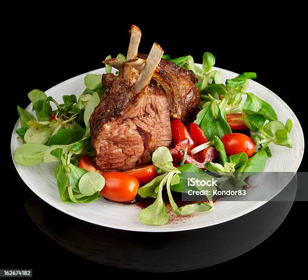Rare Fried Rack Of Lamb Isolated On Black Stock Photo - Download Image Now - Animal Bone, Black Background, Black Color